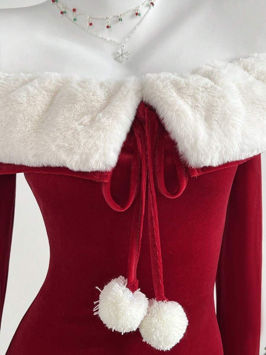 Close view of white faux fur collar and red pom-pom tie detail