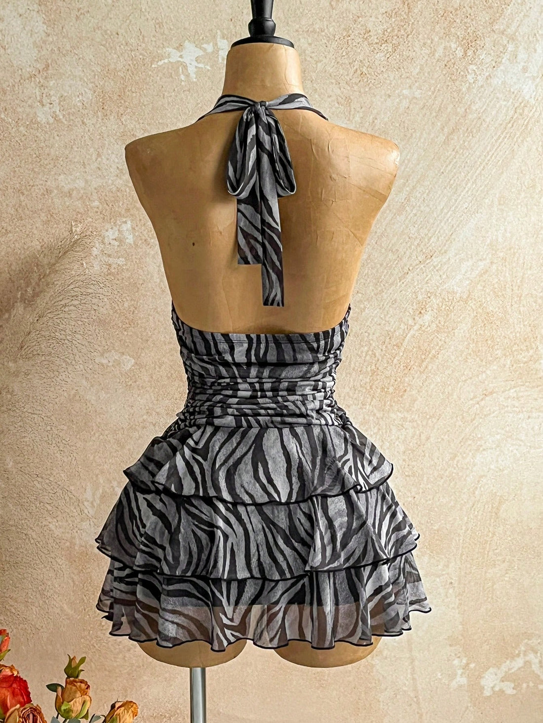 Make a bold statement with this eye-catching vintage tie-dye zebra print mini dress! Featuring a flattering V-neckline and playful color-blocked design, it's the perfect piece to channel retro vibes with modern flair. The relaxed fit works beautifully for casual outings or dressed-up occasions, while the mini length keeps things fun and flirty. Layer it with tights and boots for cooler months, or go solo when the weather warms up. A versatile wardrobe essential that brings personality and nostalgia to any o