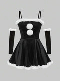 Front product view of black spaghetti strap mini dress with white faux fur trim and pom poms