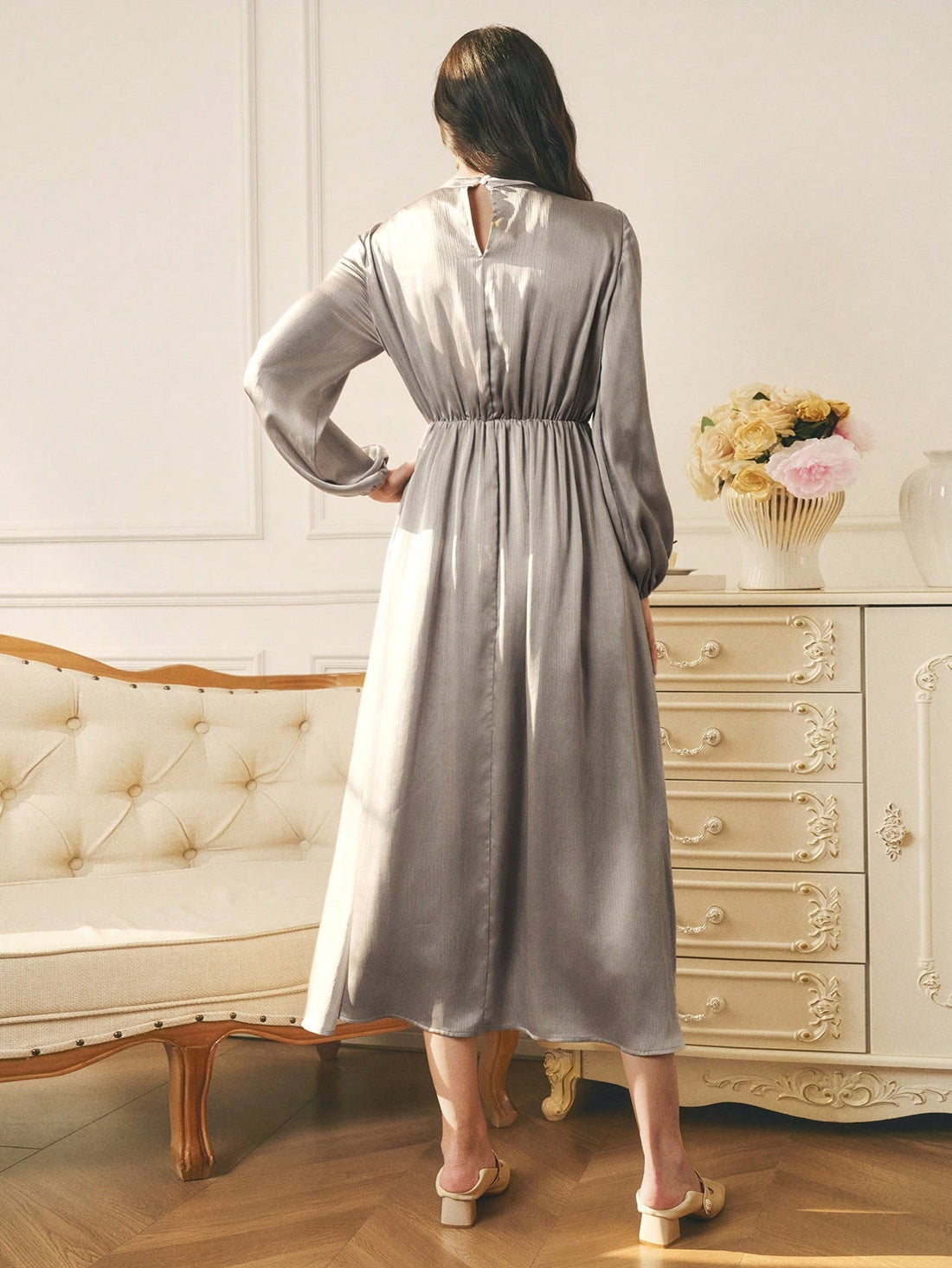 Elevate your winter wardrobe with this stunning maxi dress that's equal parts sophisticated and fun! Crafted from luxurious textured satin, it features charming ruffle detailing that adds movement and personality to every step. Whether you're heading to a holiday party or layering it over your favorite turtleneck for everyday elegance, this versatile piece delivers. The flowing silhouette flatters all figures while the rich fabric catches the light beautifully. Dress it up with heels and statement jewelry, 