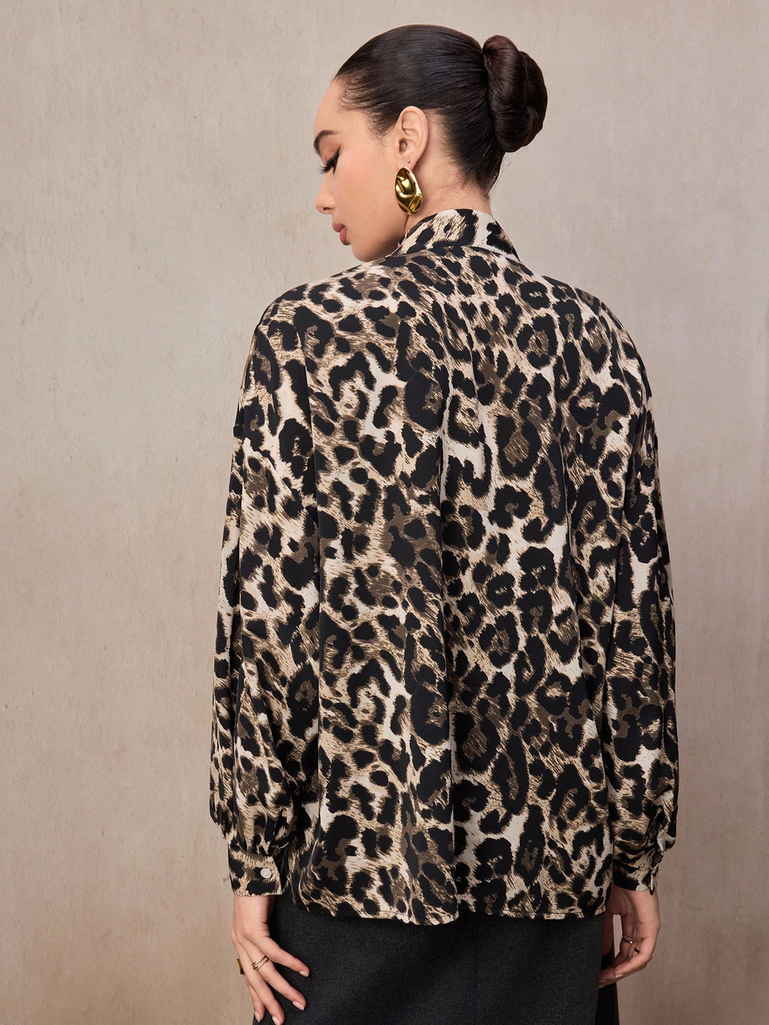 Unleash your wild side with this show-stopping two-piece set! The vintage-inspired leopard print tie blouse features a flattering silhouette that pairs perfectly with the high-waisted bodycon mini skirt for an effortlessly chic look. Whether you're heading out for a night on the town or turning heads at your next event, this set delivers bold style and confidence in one package. The classic leopard pattern never goes out of style, making it a versatile addition to your wardrobe that works season after seaso