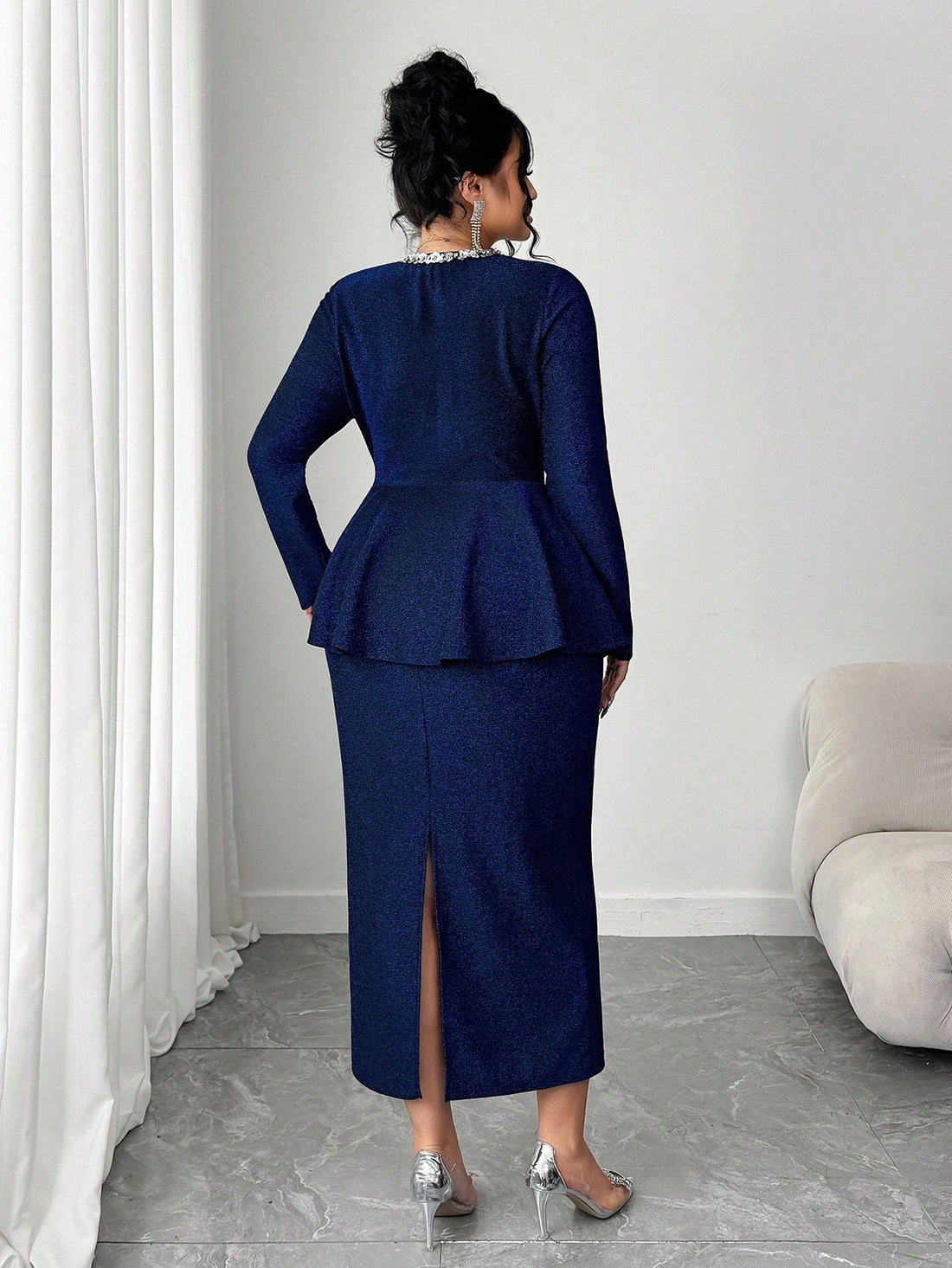 Shimmer and shine in this show-stopping maxi dress designed for curves and confidence! The luxurious glitter knit fabric catches the light with every move, while the elegant teardrop neckline frames your shoulders beautifully. A playful ruffle waist adds dimension and flatters your silhouette perfectly. From evening events to special celebrations, this plus-size stunner delivers glamour without compromise. Slip it on and prepare for compliments!