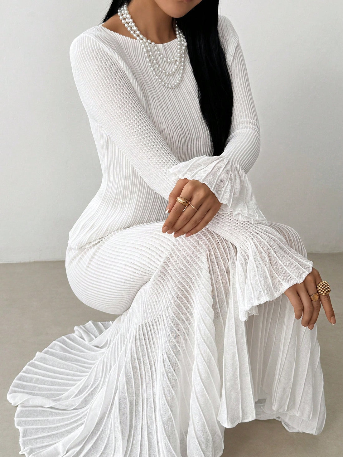 Elevate your cold-weather wardrobe with this charming two-piece set that pairs a cozy knit sweater with a gracefully pleated skirt. Perfect for layering through autumn and winter, this combo strikes the ideal balance between comfort and sophistication. The sweater's soft knit fabric keeps you warm while the skirt's structured pleats add movement and dimension to every step. Mix, match, or wear together—this versatile duo works hard to keep your seasonal style effortless and polished.