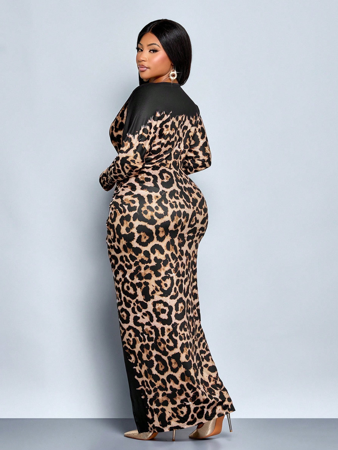 Embrace your wild side this season with our stunning leopard print maxi dress—the perfect blend of bold style and effortless elegance. The flattering deep V-neckline draws attention upward while the flowing batwing sleeves add a touch of drama and movement. Designed with plus-size curves in mind, this dress drapes beautifully and moves with you, making it ideal for everything from casual outings to special occasions. The timeless leopard pattern pairs seamlessly with your favorite boots or heels, ensuring y