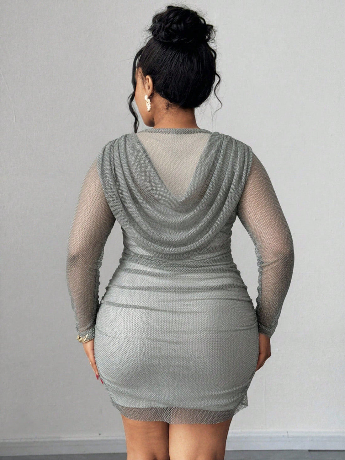 Turn heads at your next celebration in this stunning plus-size bodycon dress that hugs your curves in all the right ways. The elegant draped neckline adds a touch of sophistication while the fitted silhouette creates a show-stopping silhouette. Versatile enough for autumn gatherings or spring soirées, this glamorous piece pairs effortlessly with heels and statement jewelry for an unforgettable night out. Confidence has never looked so good!
