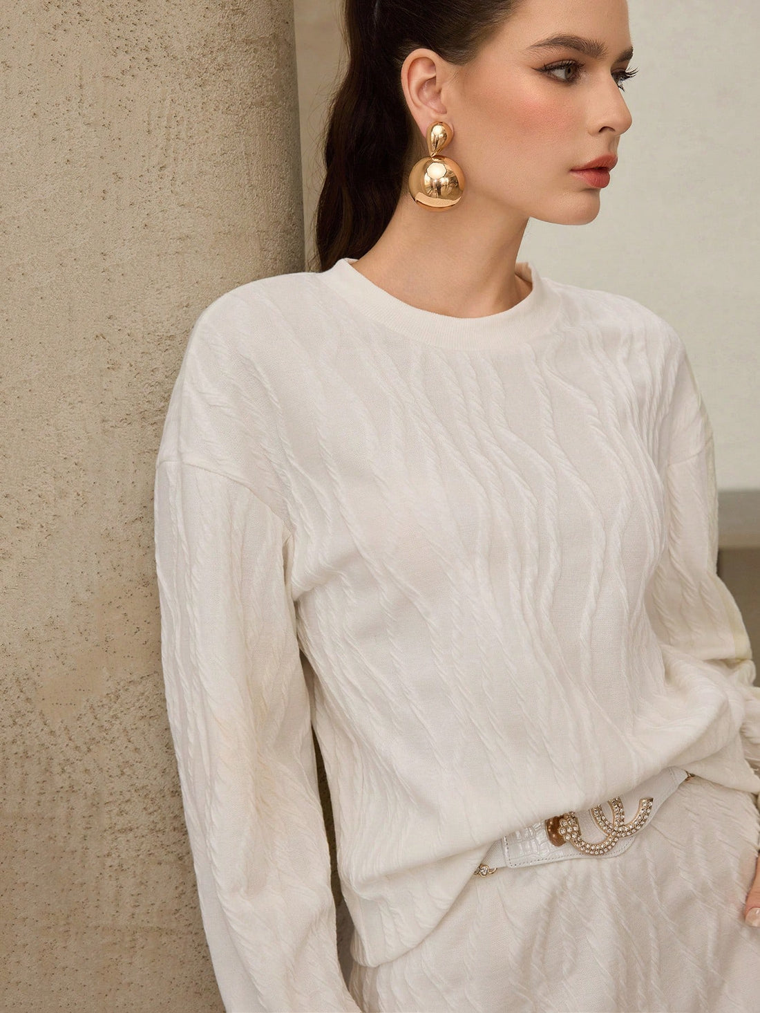 Elevate your everyday wardrobe with this charming beige knitted set that's basically a hug you can wear! The jacquard knit adds visual interest while the long sleeves and crew neck keep things cozy and put-together. Pair the matching skirt for a coordinated look that transitions seamlessly from coffee dates to casual hangouts. It's the kind of set that makes getting dressed feel effortless—no overthinking required. Perfect for anyone who loves looking polished without trying too hard.