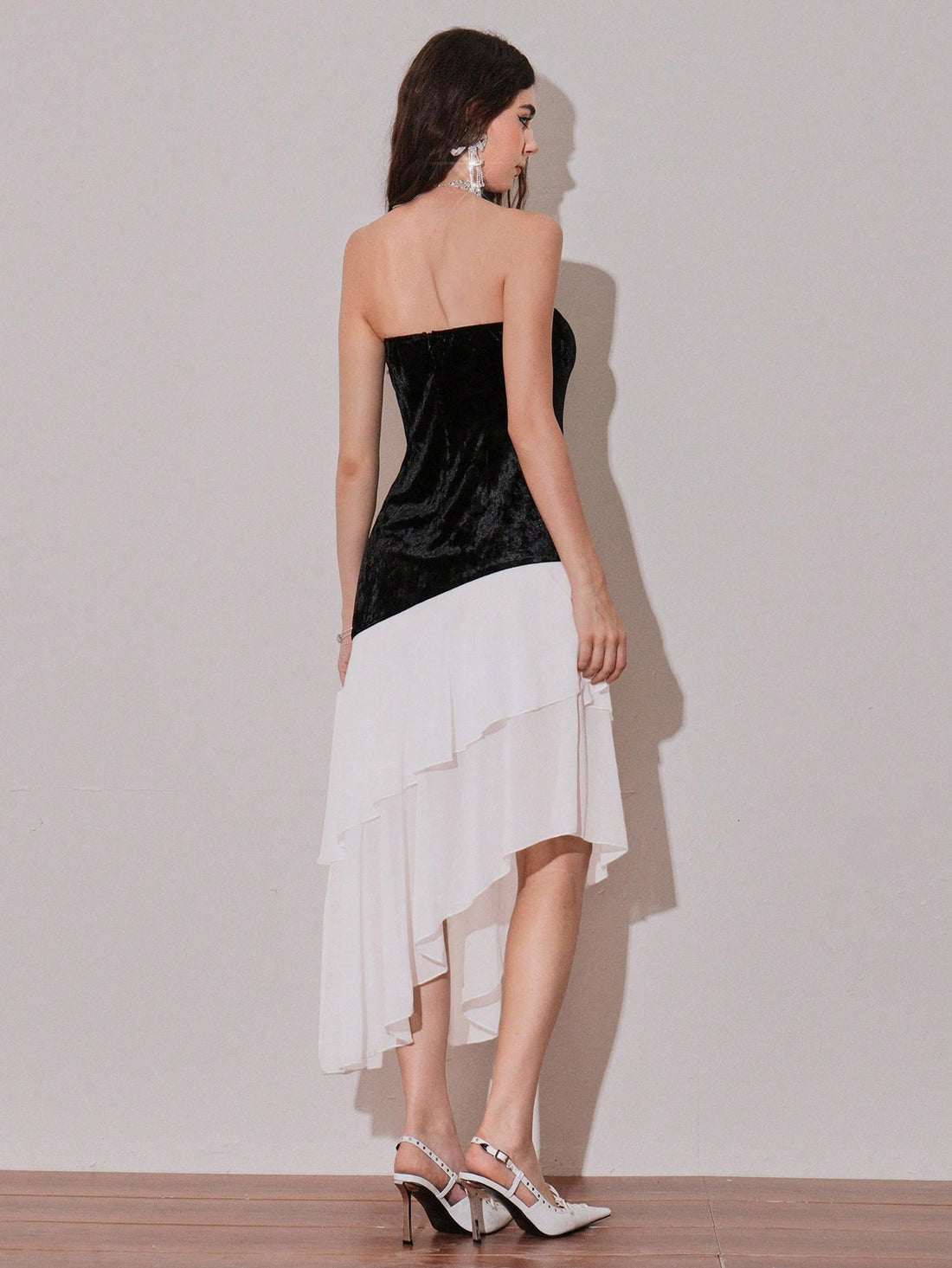 Slip into effortless sophistication with this charming midi dress that's equal parts chic and fun. The bandeau neckline offers a flattering, modern silhouette while the playful ruffle hem adds a flirty touch that catches every eye. Perfect for brunch dates, garden parties, or whenever you want to feel polished without trying too hard. This versatile piece transitions seamlessly from day to night, making it a wardrobe essential that works as hard as you do. Dress it up with heels or keep it casual with sneak