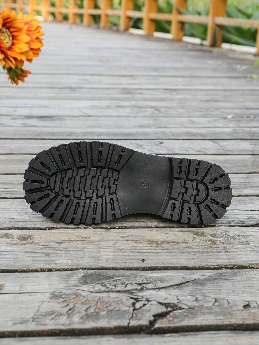 Step into edgy elegance with these British-inspired motorcycle boots that refuse to play it safe. Featuring a bold lace-up front, sturdy chunky heel, and a charming bow accent, they're the perfect blend of tough and feminine. Whether you're conquering city streets or embracing your rebellious side, these versatile boots deliver serious style in any season. Built for the bold, designed for the unforgettable.