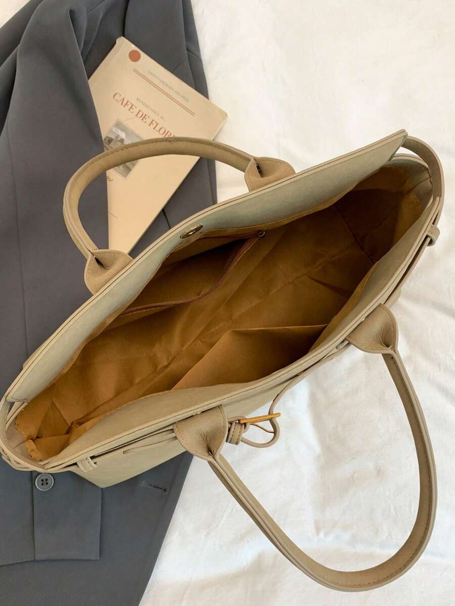 Carry your world in style with this spacious vintage-inspired tote that's equal parts sophisticated and fun. Crafted from durable faux leather, it features a roomy interior perfect for laptops, documents, and all your daily essentials—without the guilt. The timeless silhouette works seamlessly from boardroom to brunch, while the structured design keeps everything organized and accessible. Whether you're juggling work projects or weekend adventures, this tote proves that looking polished doesn't mean sacrifi