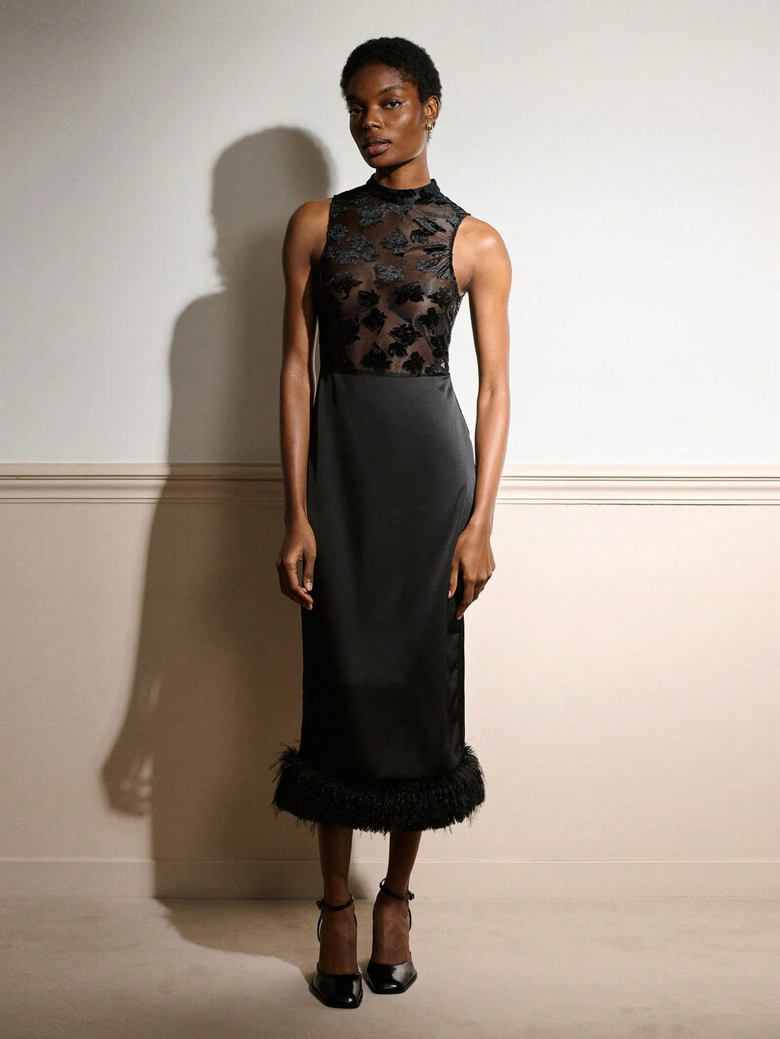 Slip into sophistication with this show-stopping black satin maxi dress that's basically a standing ovation waiting to happen. The delicate lace bodice adds a touch of romance and intricate detail, while the luxurious fur hem brings that extra glamour factor that says "yes, I'm fabulous." Perfect for autumn and winter galas, cocktail parties, or any occasion where you want to turn heads and feel absolutely divine. This is the dress that makes you feel like the main character in your own story.