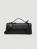 Ostrich embossed structured top handle shoulder bag with flap closure and adjustable strap
