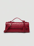 Ostrich embossed structured top handle shoulder bag with flap closure and adjustable strap