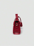 Ostrich embossed structured top handle shoulder bag with flap closure and adjustable strap