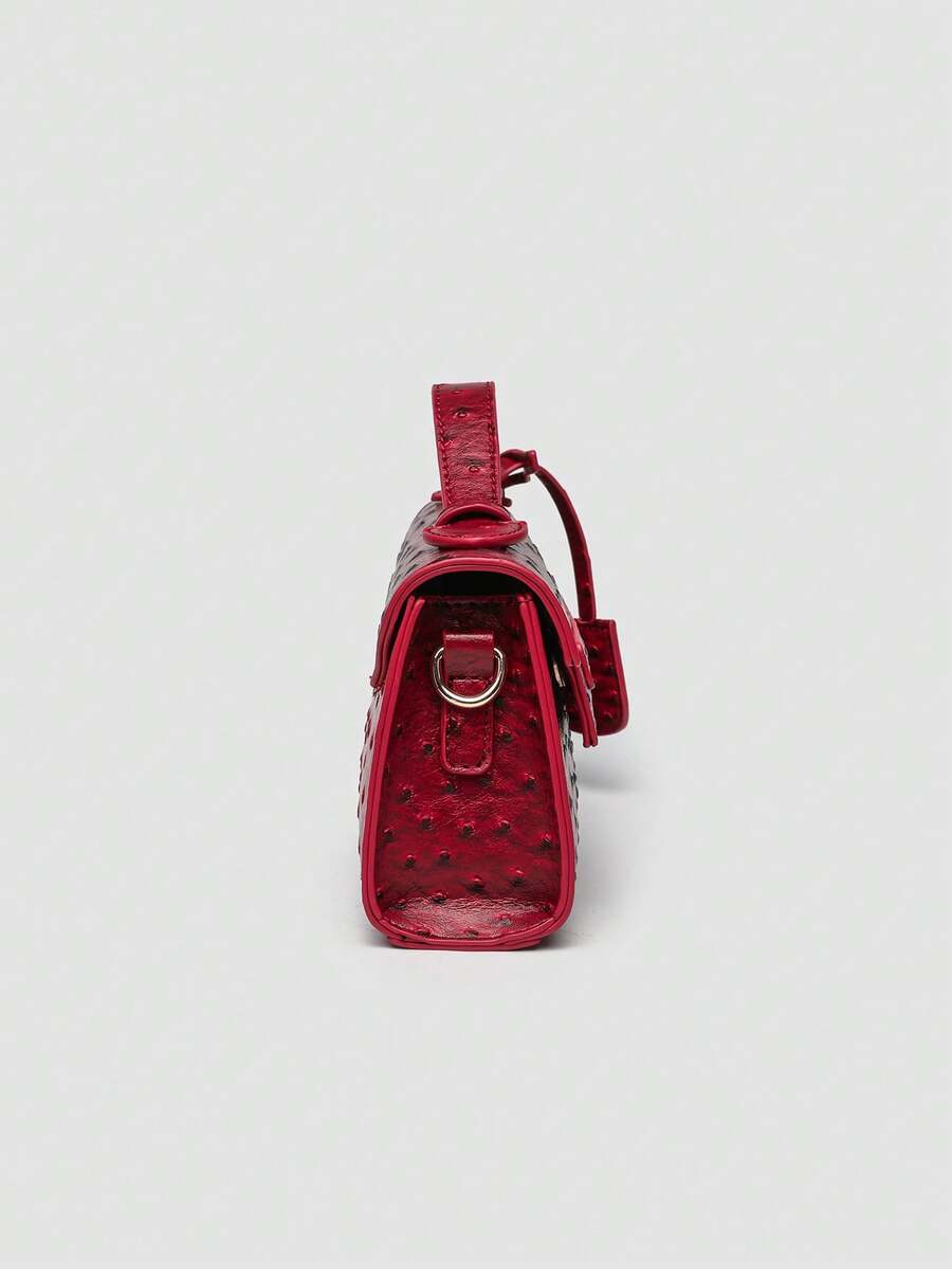 Ostrich embossed structured top handle shoulder bag with flap closure and adjustable strap