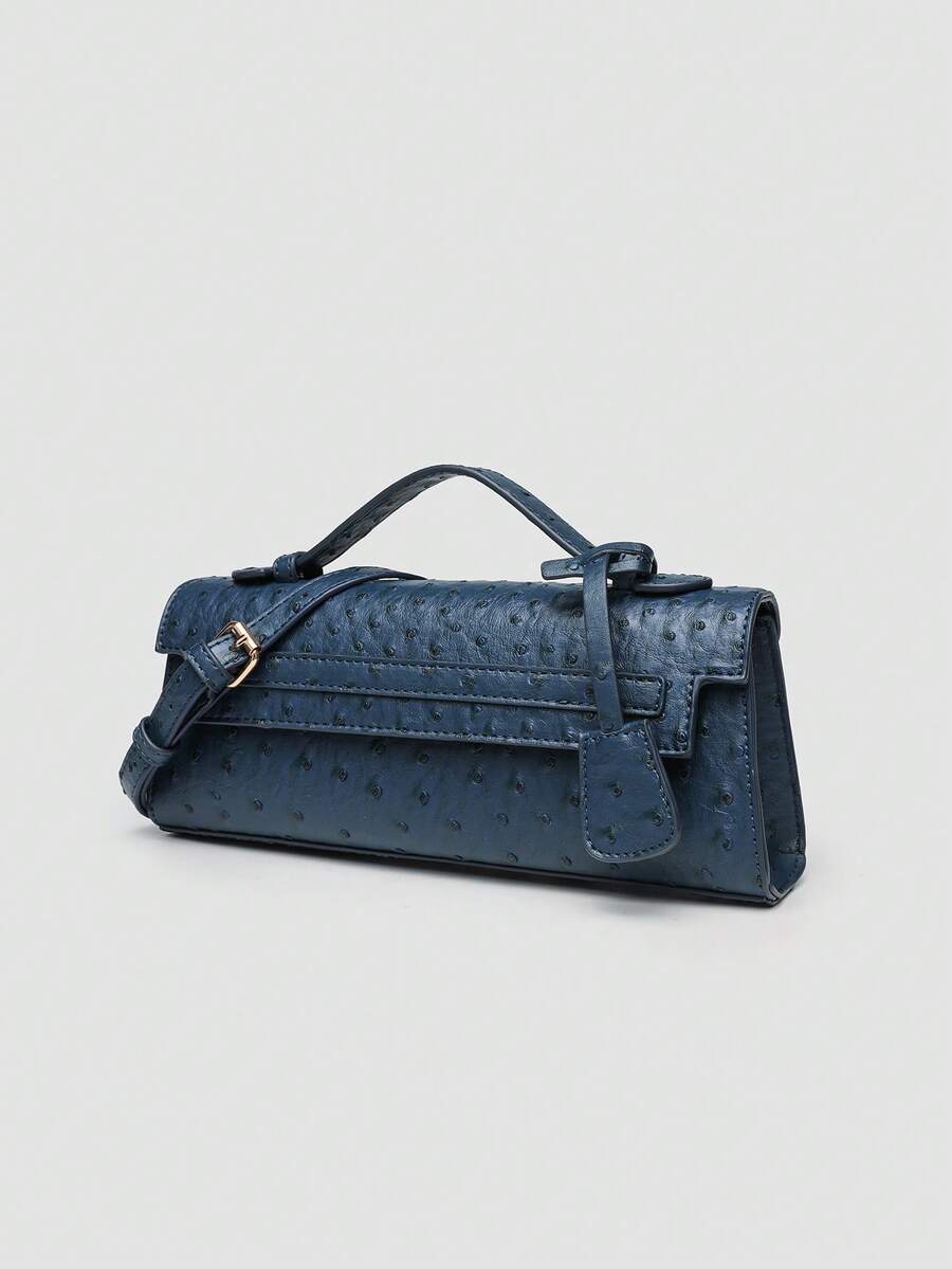 Ostrich embossed structured top handle shoulder bag with flap closure and adjustable strap