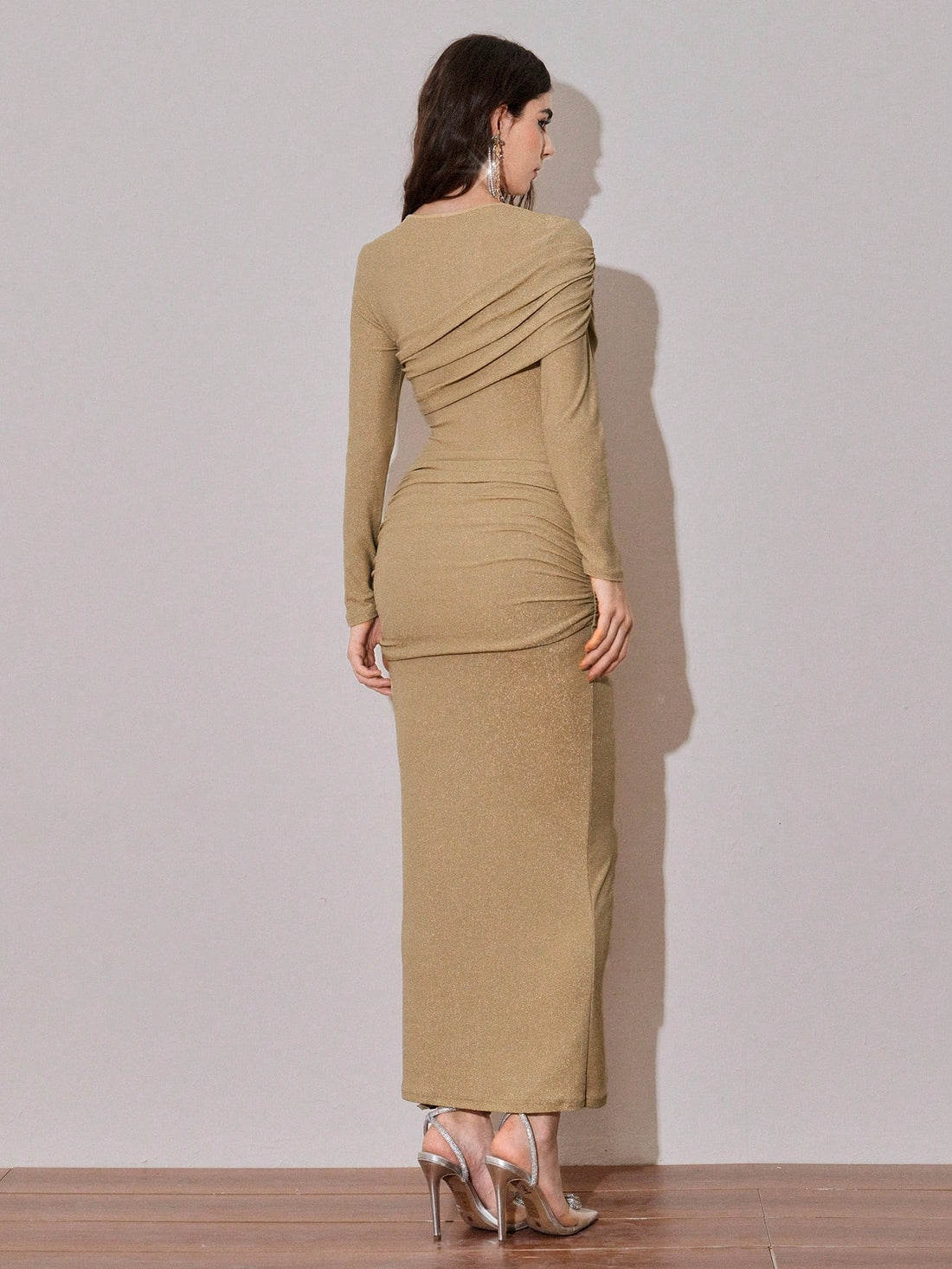 Turn heads at your next celebration in this stunning ruched bodycon dress that combines glamour with comfort. The figure-flattering design features strategic ruching that sculpts and defines, while shimmering details catch the light with every move. Perfect for parties, nights out, or any occasion where you want to feel absolutely fabulous. Slip it on and let your confidence shine as bright as the sparkle.