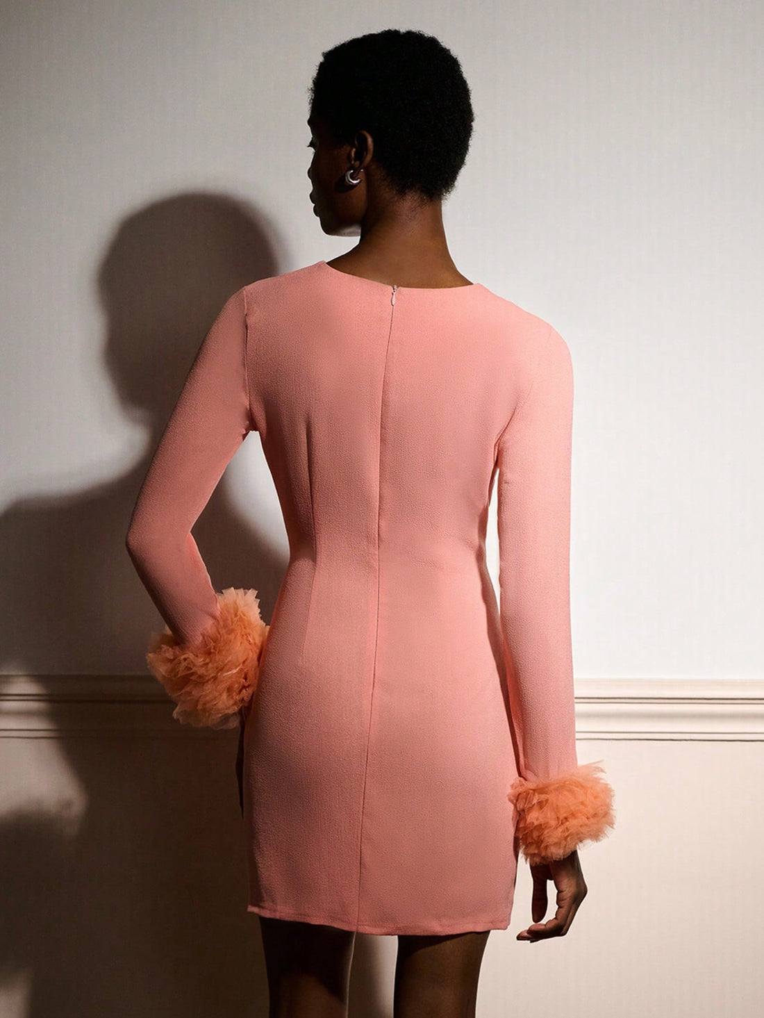 Turn heads at every autumn and winter celebration in this stunning pink mini dress. The show-stopping dramatic tulle cuffs add an unexpected flourish that transforms a simple silhouette into pure party magic. Perfect for those who dare to stand out, this piece combines playful elegance with undeniable charm. Whether you're dancing the night away or making a grand entrance, this dress delivers the confidence and style you need to own the room.