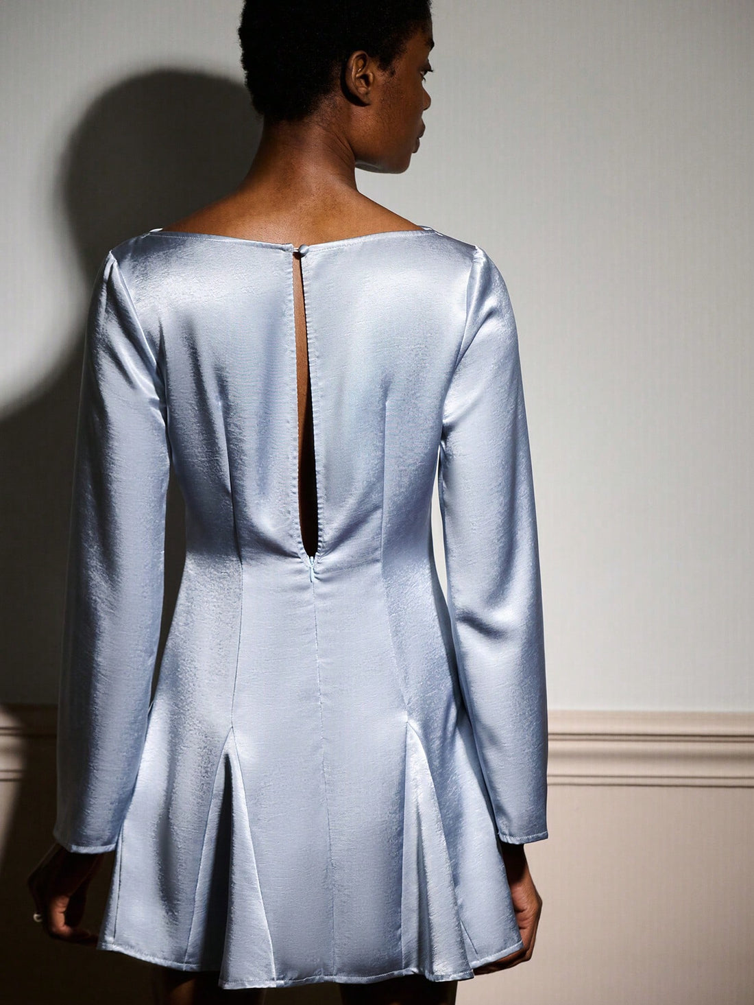 Slip into sophistication with this stunning silver blue satin mini dress—your new party essential! The luxe satin fabric drapes beautifully while the flare sleeves add a playful, romantic touch. A pleated hem creates movement and dimension, perfect for twirling through autumn and winter celebrations. Whether you're heading to a holiday gathering or a night out with friends, this dress strikes the ideal balance between elegant and fun. Pair it with heels and your favorite accessories for an unforgettable loo