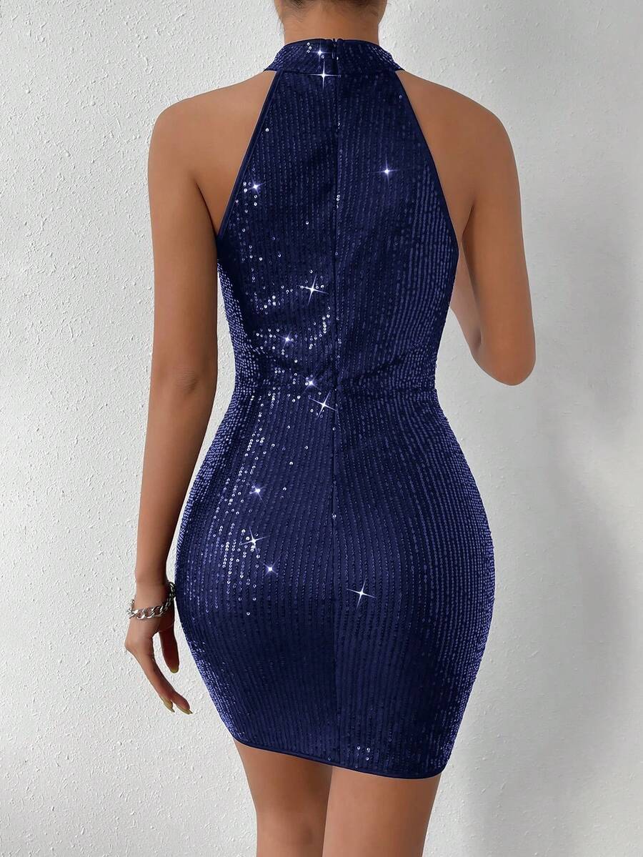 Turn heads at your next holiday celebration in this show-stopping halter neck sequin dress! The figure-hugging bodycon silhouette is beautifully enhanced by strategic ruching that flatters every curve, while shimmering sequins catch the light with every move. The elegant halter neckline adds a touch of sophistication and keeps the focus on your radiant glow. Perfect for festive parties, New Year's Eve, or any occasion calling for glamorous flair. Slip into confidence and let your sparkle do the talking!
