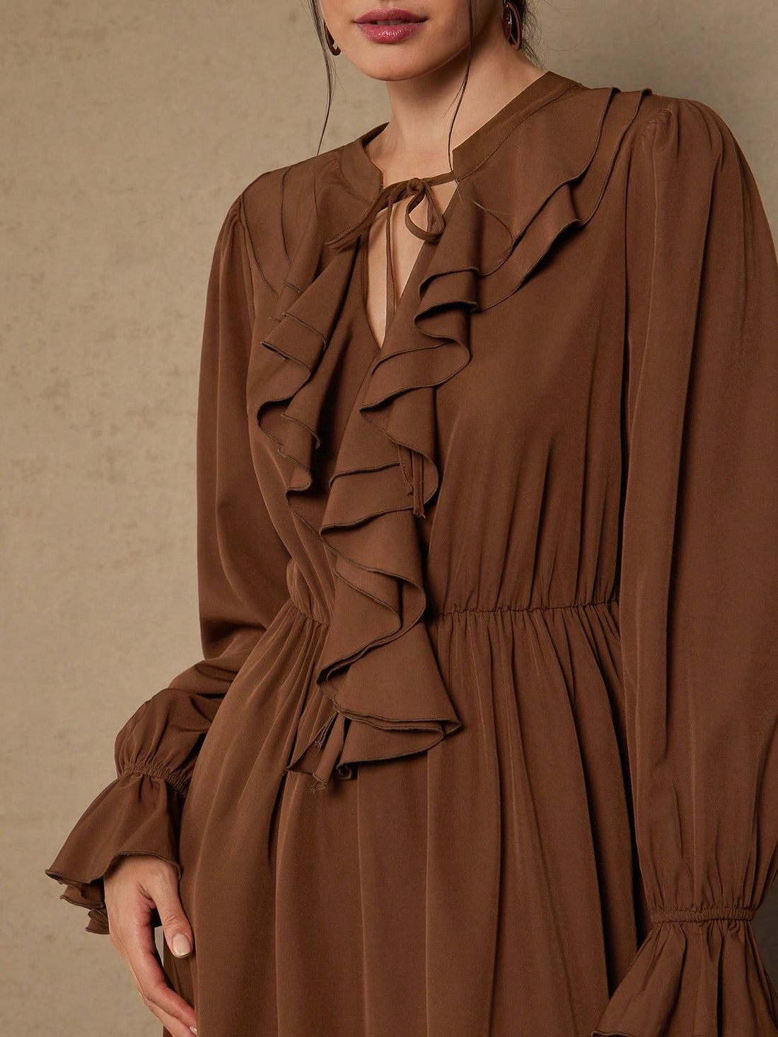 Elevate your wardrobe with this stunning plus-size dress that's equal parts sophisticated and fun! The long sleeves provide elegant coverage while the charming ruffle tie neck adds a flirty touch that draws the eye upward. Crafted in a timeless solid color, this versatile piece transitions seamlessly from office to evening events. The thoughtfully designed silhouette flatters curves beautifully, giving you confidence with every wear. Perfect for anyone who refuses to compromise on style or comfort—because l