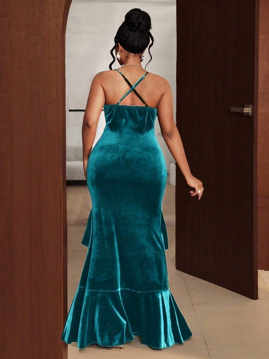Slip into pure elegance with this stunning plus-size velvet maxi dress that's ready to turn heads at any occasion. The luxurious velvet fabric drapes beautifully while the charming ruffle front adds a touch of romantic flair. The criss-cross back design creates an alluring silhouette that flatters your curves and keeps things interesting from every angle. Whether you're heading to a special date night or celebrating at a party, this dress delivers sophistication with a playful twist. Perfect for anyone who 