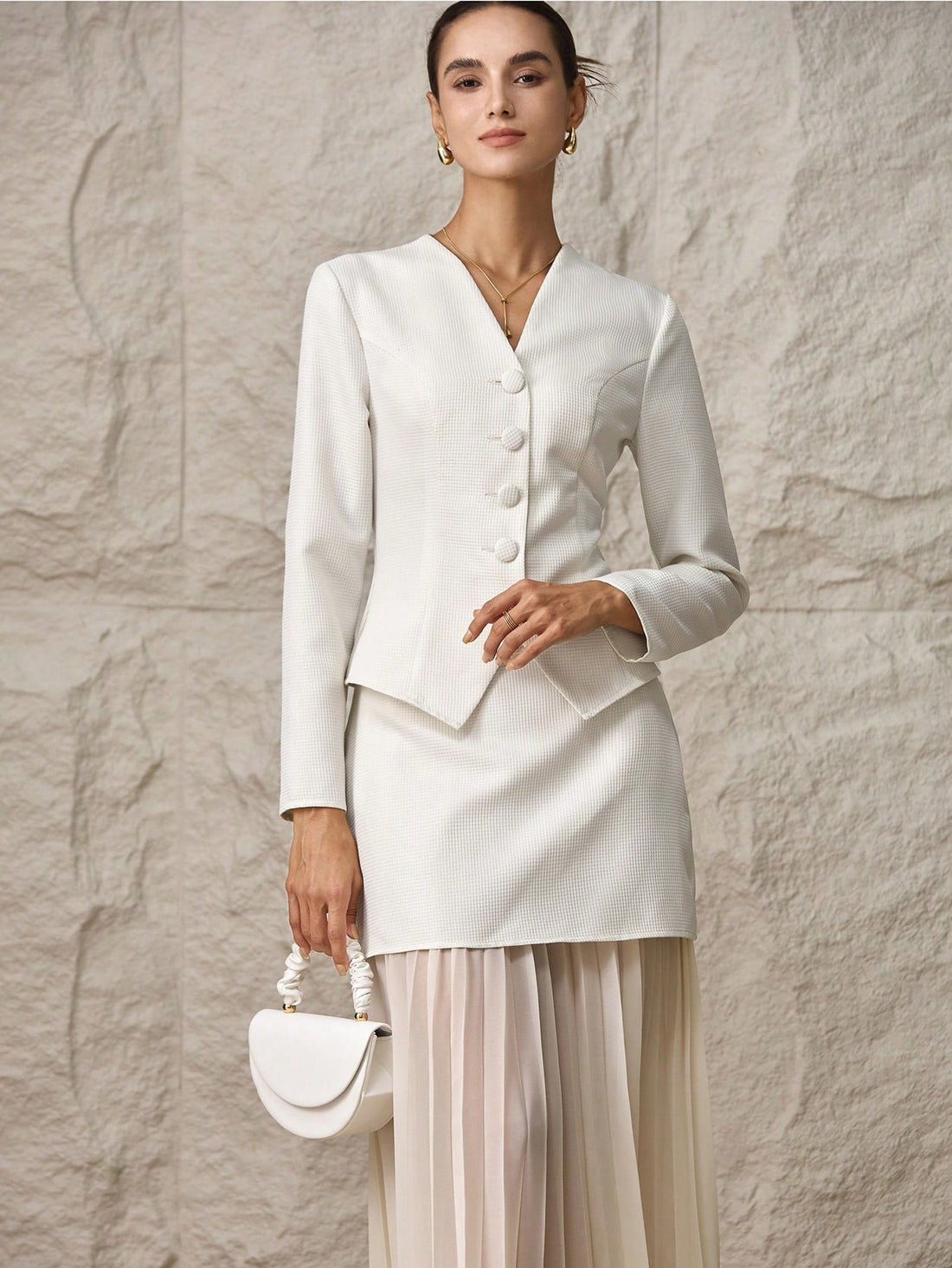 Elevate your wardrobe with this fabulous two-piece ensemble that's ready for anything! The crisp single-breasted jacket brings polished sophistication, while the gracefully pleated skirt adds movement and charm. Perfect for office meetings, weekend brunches, or that special occasion when you want to feel absolutely stunning. Mix, match, or wear together—this dynamic duo gives you endless styling possibilities. Timeless elegance meets modern flair in one irresistible set.