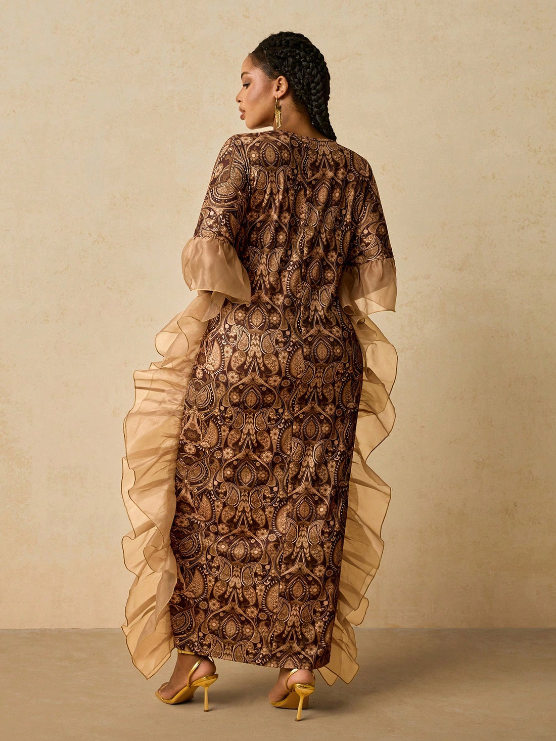 Celebrate in style with this stunning African print kaftan dress, designed for curves and confidence. The flattering V-neckline and cascading ruffles create movement and dimension, while the vibrant print brings festive energy to any holiday gathering. Perfect for Christmas parties, New Year's Eve, or any special occasion, this plus-size beauty combines comfort with elegance. Slip it on and let the rich colors and bold patterns do the talking—because looking fabulous should feel effortless.