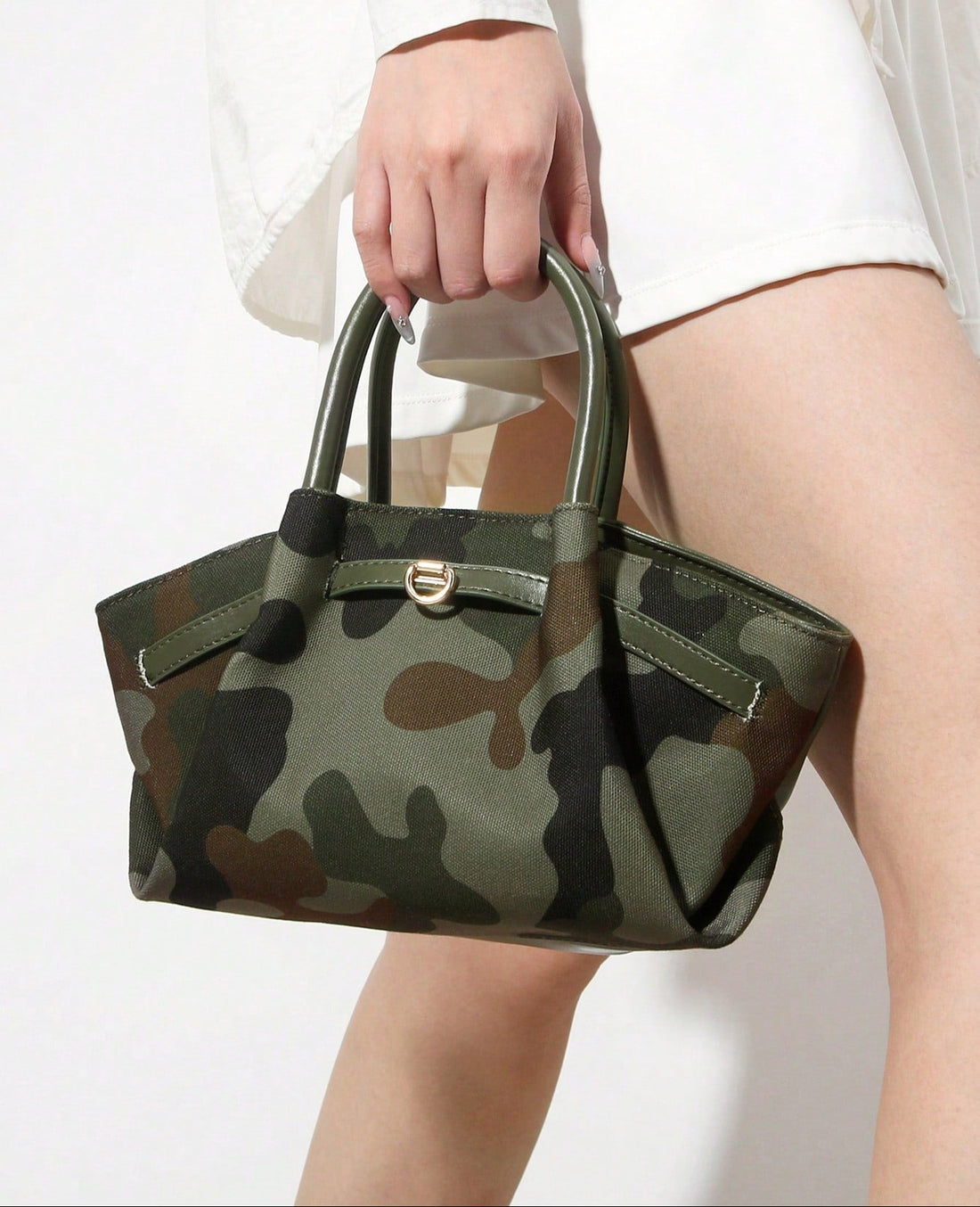 Elevate your everyday carry with this stylish camouflage tote that blends edgy patterns with sophisticated PU leather patchwork details. The spacious interior keeps your essentials organized, whether you're heading to the office, jet-setting across the globe, or rushing between classes. Featuring a detachable strap, switch between shoulder carry and crossbody wear depending on your mood. Durable construction meets fashion-forward design, making this tote the perfect companion for anyone who refuses to compr