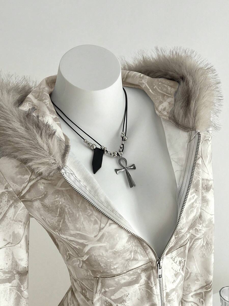 Close detail of beige camouflage faux-fur hood zip-up hoodie