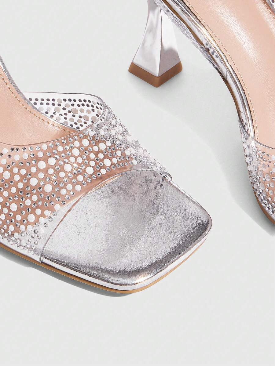 Step into the spotlight with these stunning glass rhinestone chunky heel sandals that catch every light and turn heads at every event. Featuring an elegant pearl rose gold design, these beauties deliver serious sparkle without sacrificing comfort. The chunky heel keeps you stable and stylish, whether you're dancing at a wedding, celebrating at a party, or making an entrance at seasonal gatherings. The shimmering rhinestone details add that perfect touch of glamour to elevate any outfit from ordinary to abso