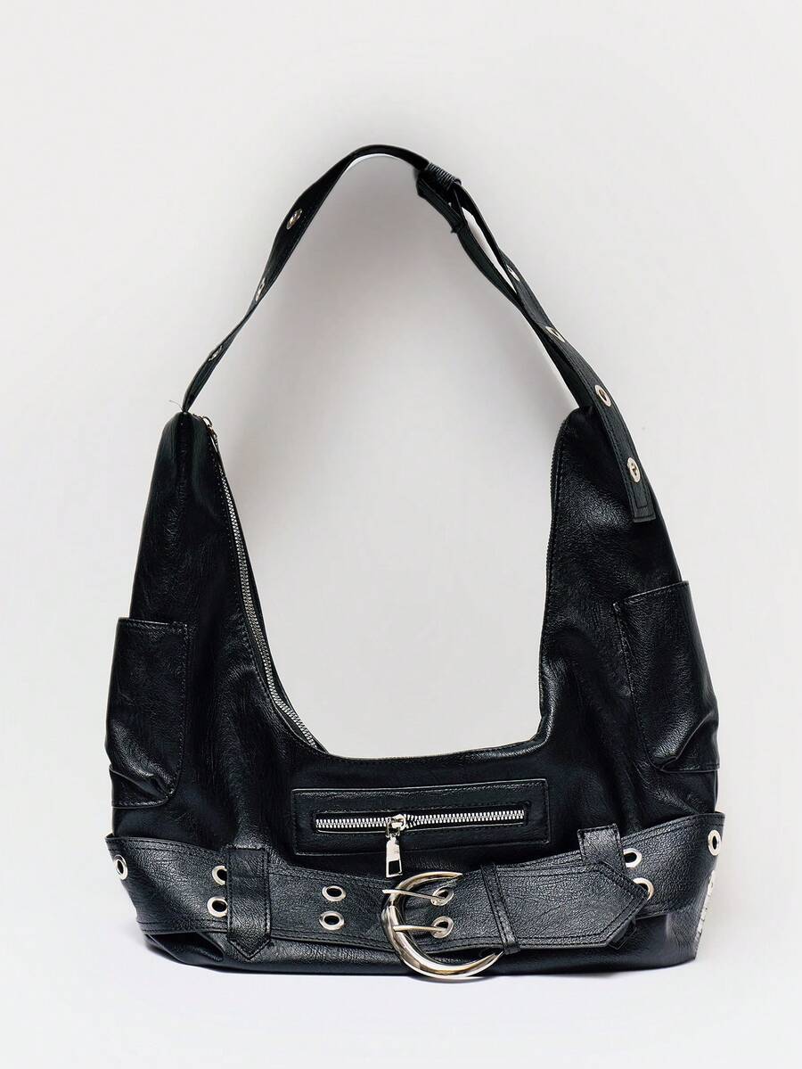 Detail view of black hobo bag showing belt buckle metal grommets and texture