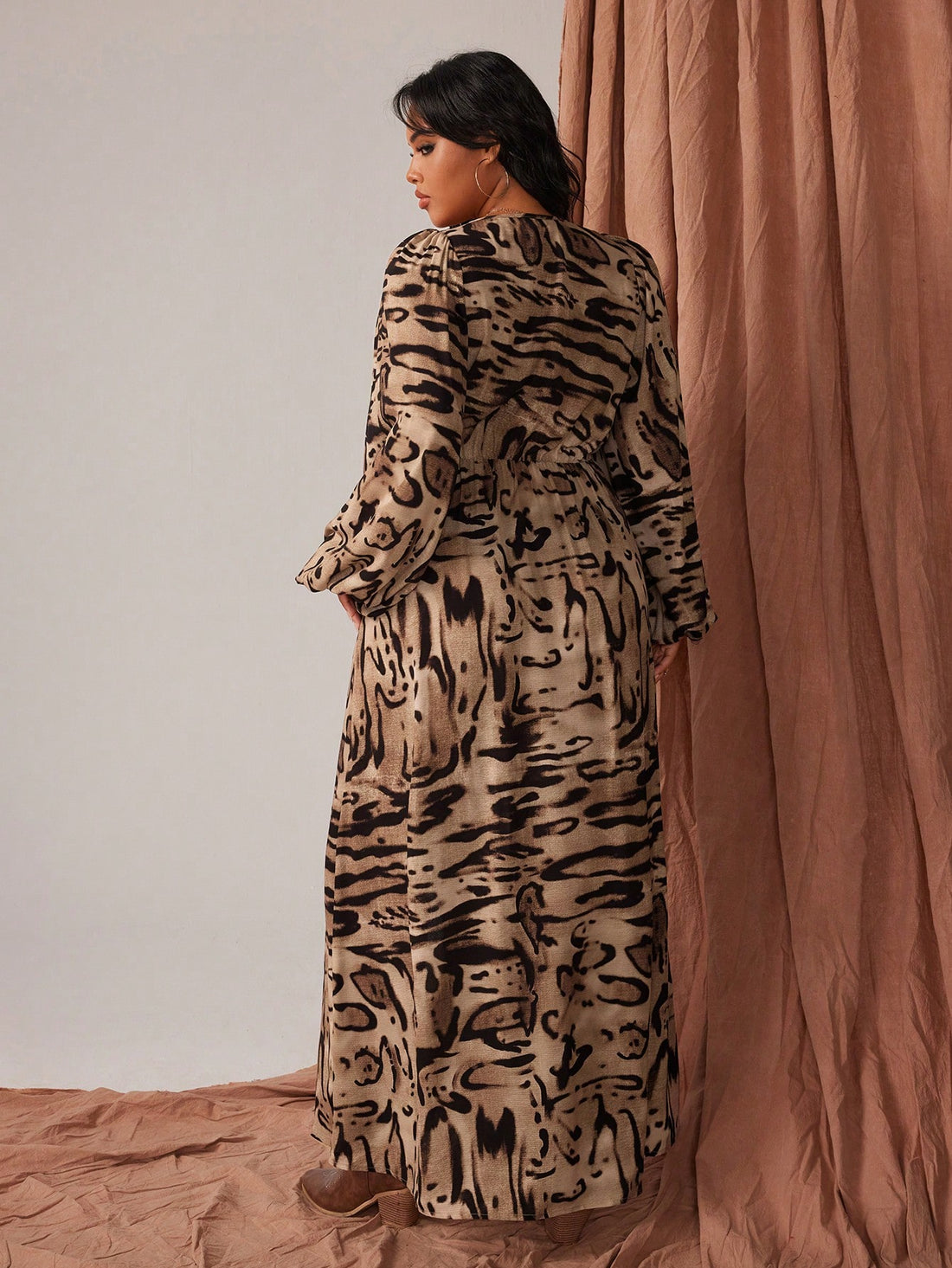 Make a statement in this stunning zebra print maxi dress that celebrates your curves with effortless style. The flattering V-neckline and loose, flowing silhouette create a graceful drape, while playful fringe details add movement and personality to every step. Crafted from soft polyester, this long-sleeved beauty transitions seamlessly from brunch to evening events. Perfect for anyone who refuses to blend in—rock that wild side with confidence and comfort!