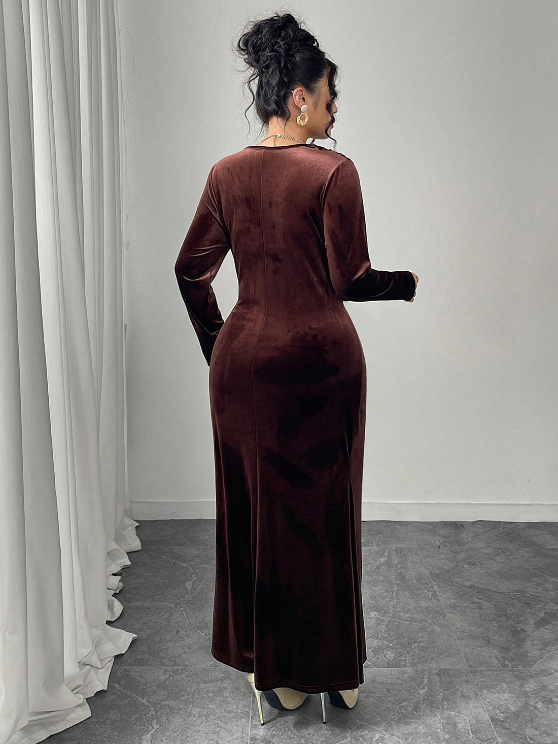 Slip into sophistication with this stunning velvet draped neck dress that's ready for anything life throws your way. The luxurious velvet fabric drapes beautifully at the neckline, while fitted long sleeves and a tailored silhouette create an effortlessly chic look. Whether you're heading to a dinner party, special event, or just want to feel fabulous on a regular day, this dress delivers elegance with a wink. Available in regular and plus sizes, because every body deserves to feel amazing in velvet.