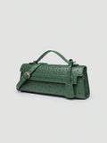 Ostrich embossed structured top handle shoulder bag with flap closure and adjustable strap