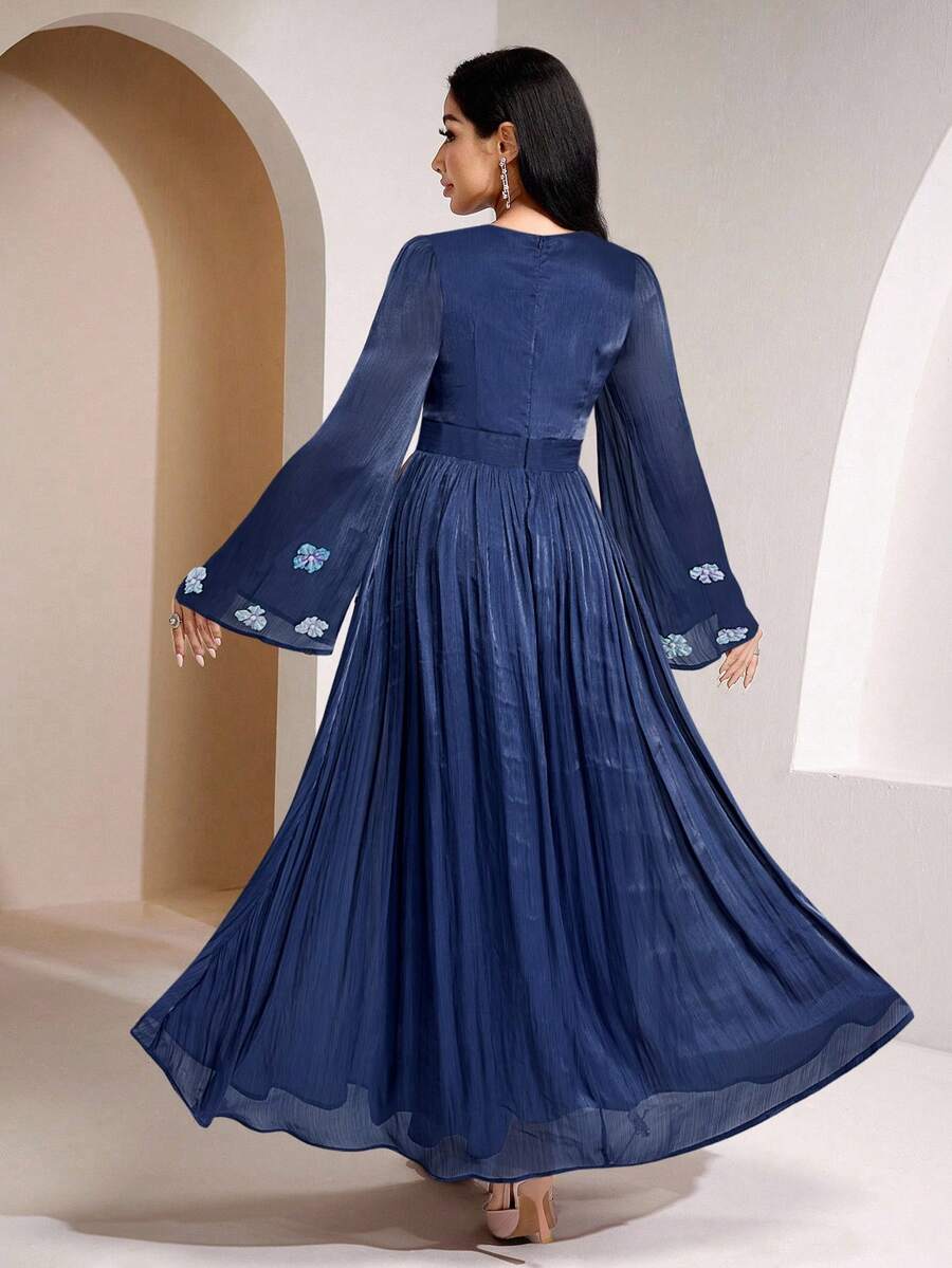 Elevate your wardrobe with this stunning long-sleeve dress that brings dimension and drama to your everyday style. The intricate 3D floral detailing catches light beautifully, creating visual depth that transforms a simple silhouette into a fashion-forward statement piece. Perfect for those moments when you want to look effortlessly put-together without trying too hard. The solid color base keeps things sophisticated while the textured florals add just the right amount of personality. Whether you're heading