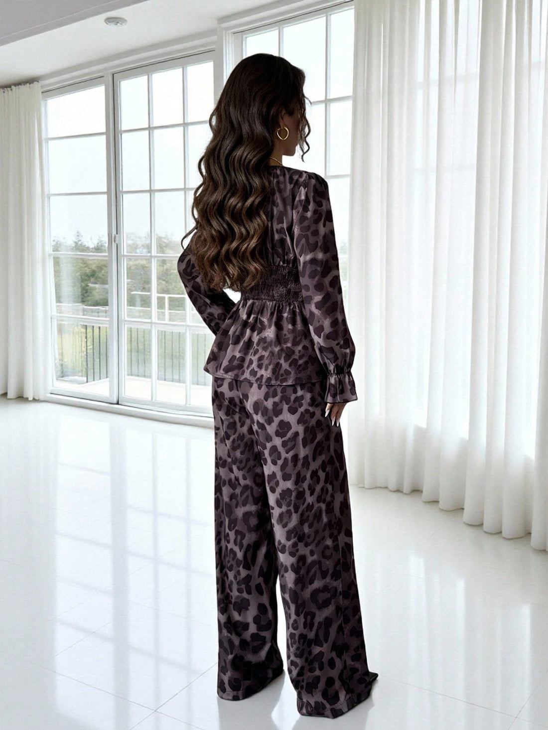 Unleash your wild side this season with our stunning leopard print 2-piece set! Featuring a chic matching top and wide-leg pants with charming ruffle hems, this ensemble delivers effortless style for autumn and winter. The bold animal print adds personality to any outfit, while the relaxed silhouette keeps you comfortable all day long. Perfect for casual outings or elevated everyday wear, this set proves that fashion-forward doesn't have to mean complicated. Mix, match, or wear together—either way, you'll t