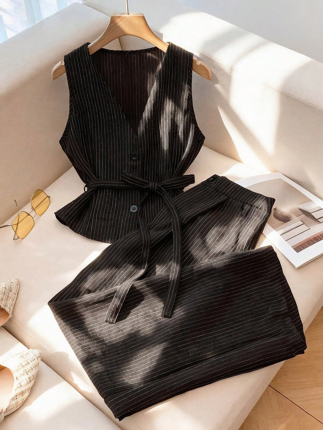 Stripes never go out of style—and this chic two-piece set proves it! Pair the sleek V-neck sleeveless top with tailored straight-leg pants for an effortlessly polished look that works from the office to weekend brunch. The timeless striped pattern adds visual interest while the clean silhouette keeps things sophisticated. Mix, match, or wear together—this versatile set is your new go-to for looking put-together without trying too hard.