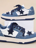 Side view of blue and white patchwork denim sneakers with frayed star appliques, navy laces, and cream platform sole