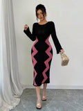 Front view of black and pink bodycon sweater midi dress with zigzag side panels and boat neckline