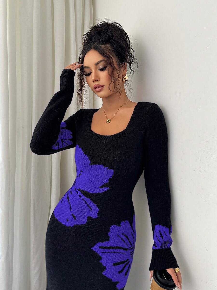 Close front view of black and blue-violet floral sweater dress with ribbed square neckline and cuffs