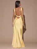 Back view pale yellow satin gown with low open back and crisscross tie straps