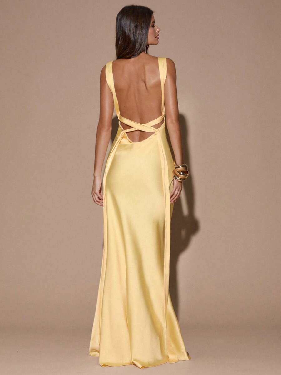 Back view pale yellow satin gown with low open back and crisscross tie straps