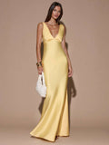 Yellow satin maxi dress with fitted bodice and flared floor-length hem