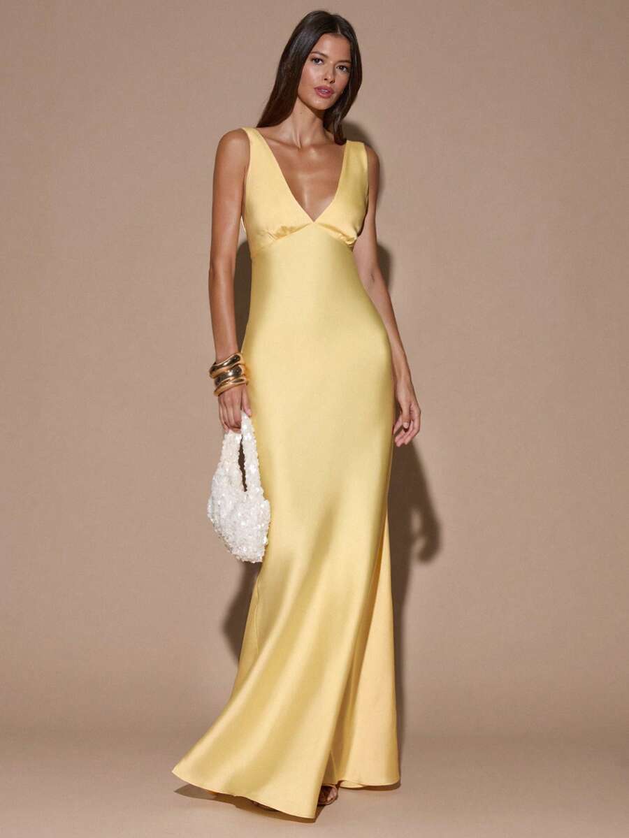 Yellow satin maxi dress with fitted bodice and flared floor-length hem