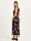 Rear three-quarter studio view of black illustrated sleeveless maxi dress