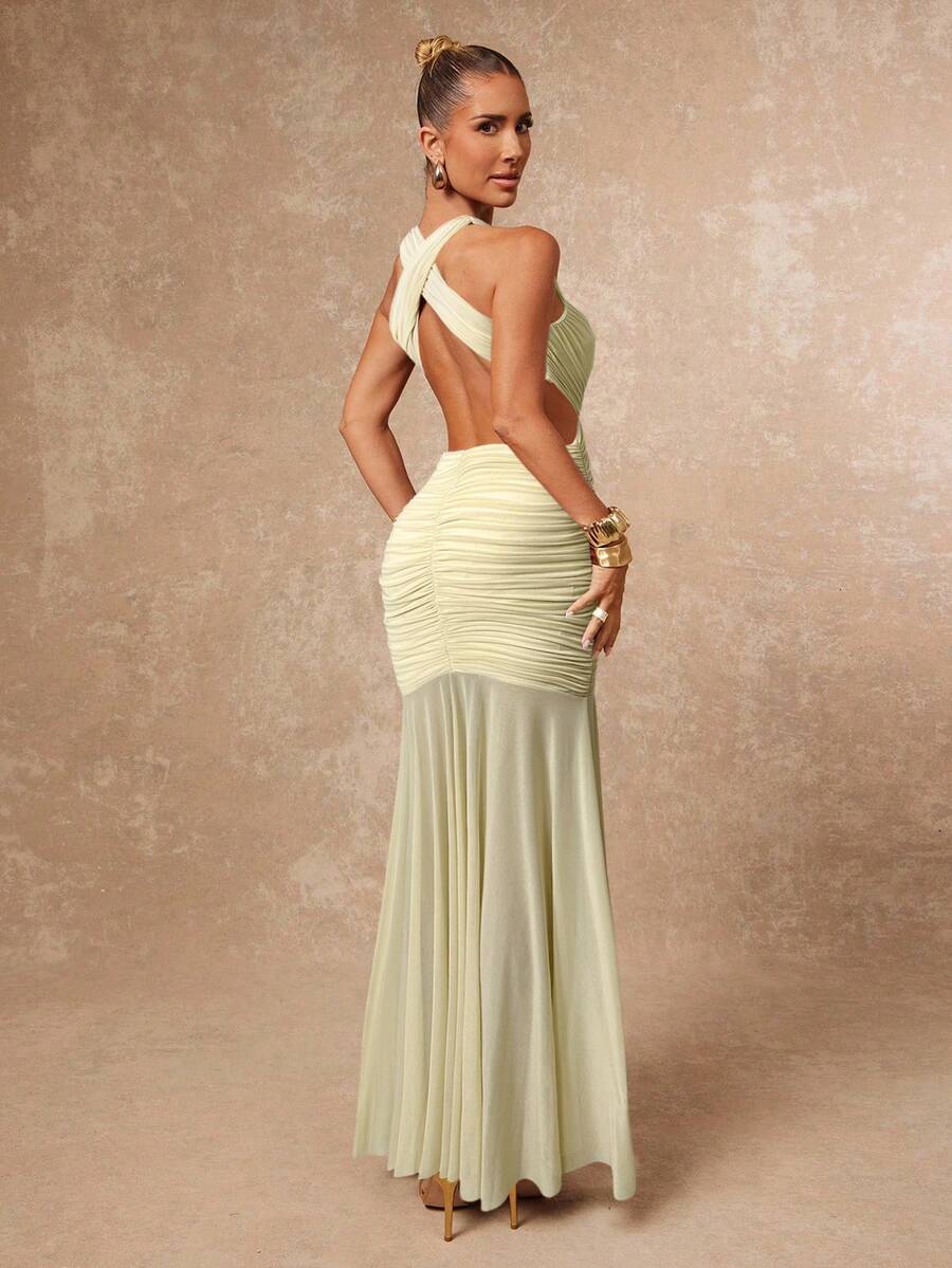 Turn heads in this stunning halter backless dress that perfectly blends sophistication with a flirty edge. The mesh patchwork detailing adds an alluring peek-a-boo element, while the gracefully flared skirt creates a flattering silhouette that moves beautifully with every step. Whether you're heading to a night out or a special occasion, this dress delivers elegance with just the right amount of sass. The open back design makes a bold statement, proving that sometimes less really is more.