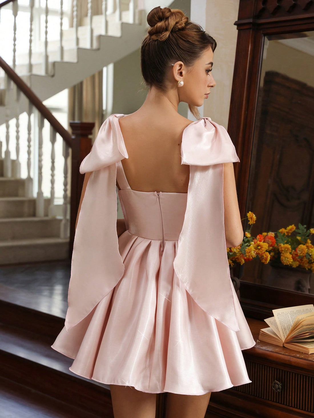 Turn heads at your next celebration in this charming mini dress featuring a statement bowknot detail and voluminous puff skirt. The playful silhouette combines feminine elegance with modern flair, creating an effortlessly chic look that transitions from cocktail hour to dancing the night away. Perfect for parties, date nights, or any occasion calling for a touch of whimsy and style.