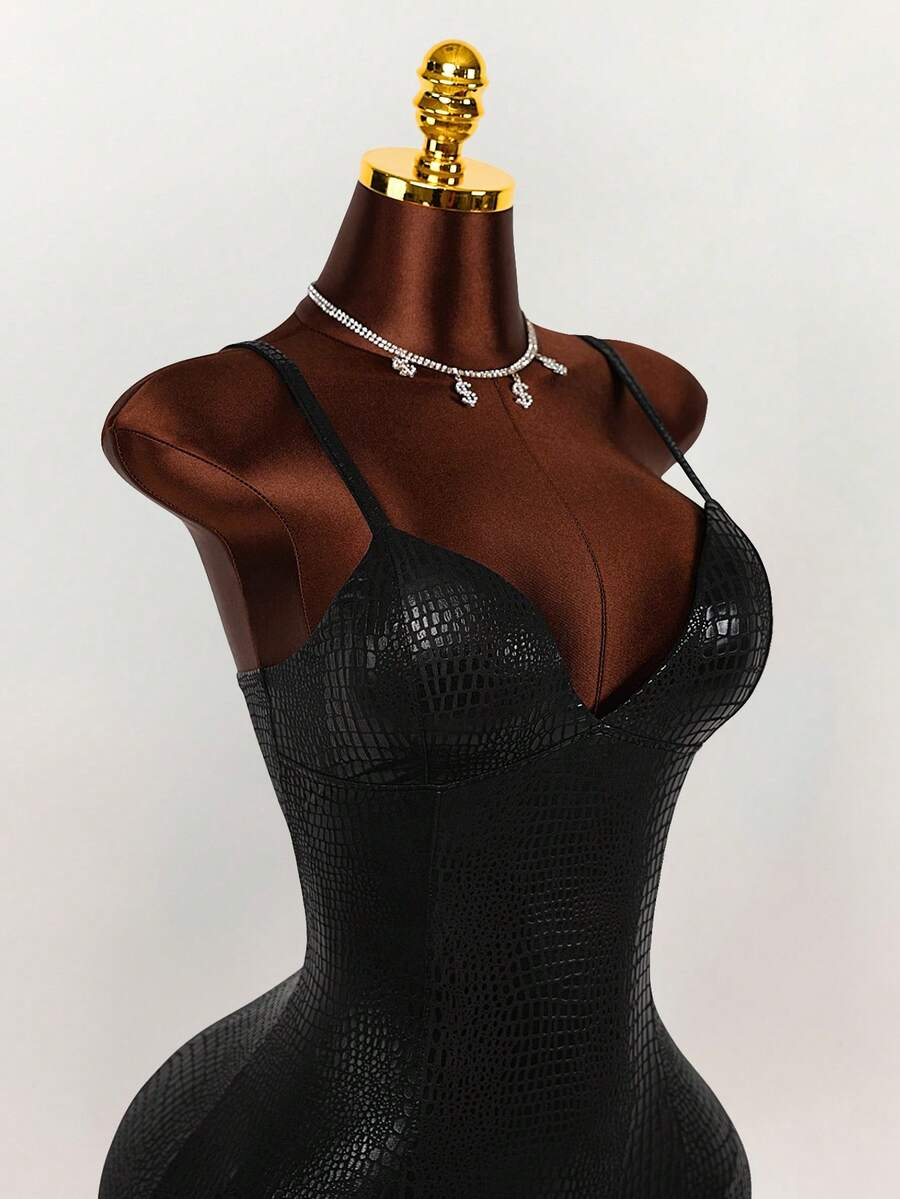Close-up of black embossed crocodile-texture cami dress