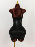 Back view of black glossy crocodile-texture bodycon mini dress