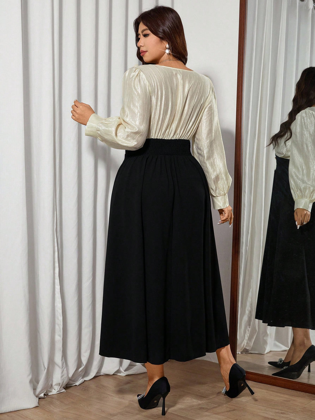 Elevate your wardrobe with this stunning color block midi dress that celebrates curves in all the right ways! The flattering V-neck and long sleeves create a sophisticated silhouette, while the bold color blocking adds a modern twist that keeps things fun and fresh. Perfect for everything from brunch dates to evening events, this plus-size beauty delivers elegance without taking itself too seriously. Slip it on and feel fabulous!